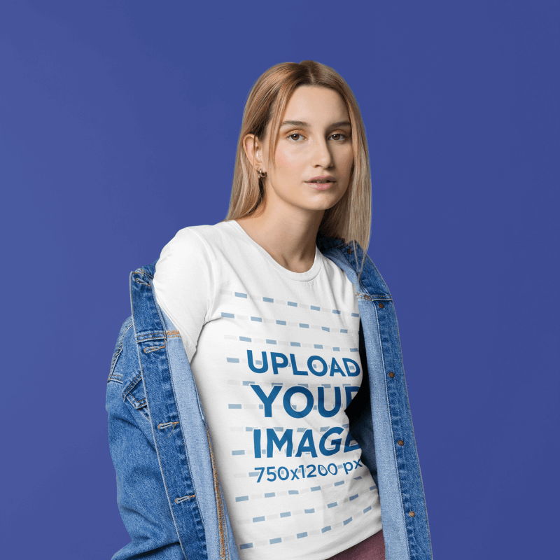 Mockup Of A Serious Woman Wearing A Bella Canvas T Shirt And A Denim Jacket