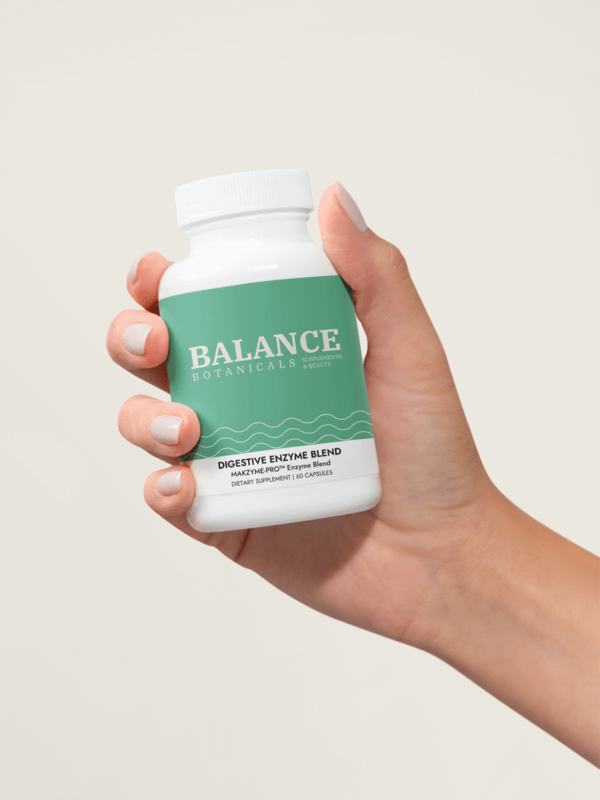 Printify Digestive Enzyme Blend Supplemen Mockup Featuring A Woman's Hand With Painted Nails And A Wellness Logo