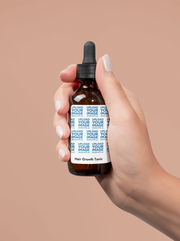 Printify Hair Growth Tonic Mockup Featuring A Woman's Hand With Painted Nails