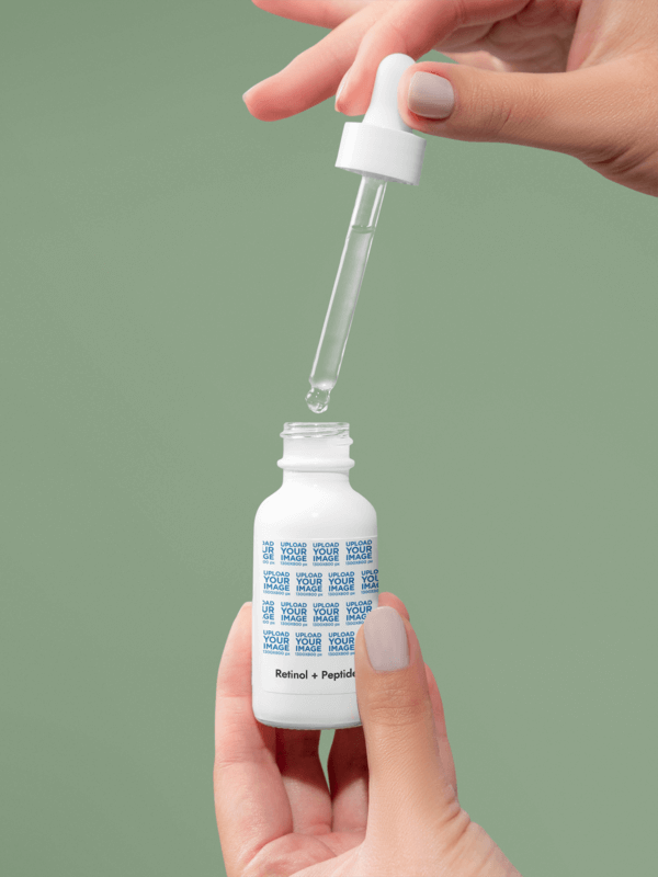 Printify Retinol And Peptide Face Serum Mockup Featuring A Woman's Hand Opening A Dropper