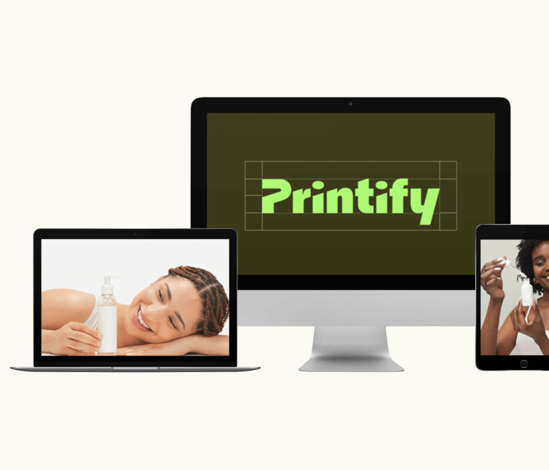 Imac Macbook Pro And Ipad Mini Mockup Over A Plain Background With Printify's Logo