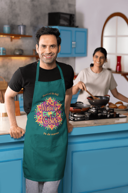 Kodenipr Club Apron Mockup Featuring A Happy Man Posing In A Kitchen M41145