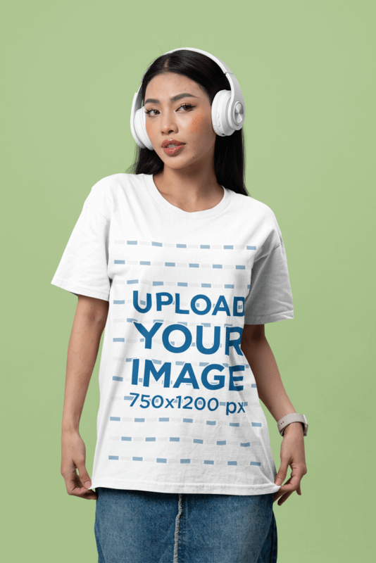 Bella Canvas T Shirt Mockup Featuring A Serious Woman Posing With White Headphones