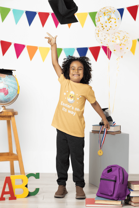 Bella Canvas 3001t Tee Mockup Of A Cheerful Boy Throwing In The Air A Graduation Hat