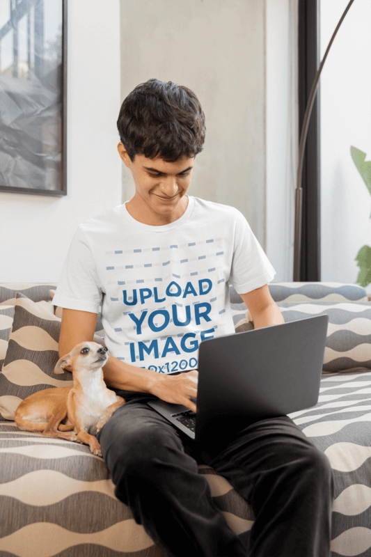 Bella Canvas 3001y T Shirt Mockup Of A Man Working On His Laptop With His Chihuahua Pet