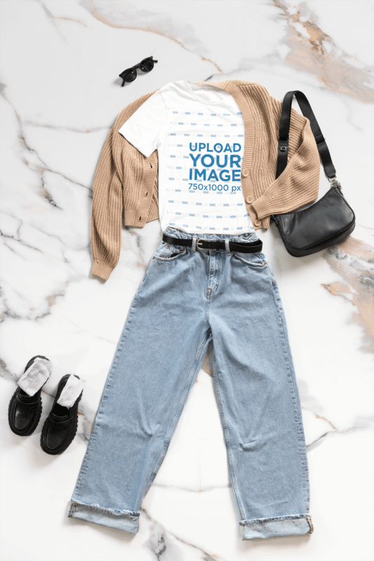 Outfit Mockup Featuring A Bella Canvas 3001 T Shirt With Nice Garments Placed On A Marble Floor