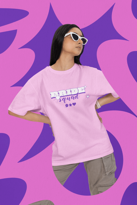 Oversized T Shirt Mockup Featuring A Woman With Sunglasses Posing Against A Textured Backdrop