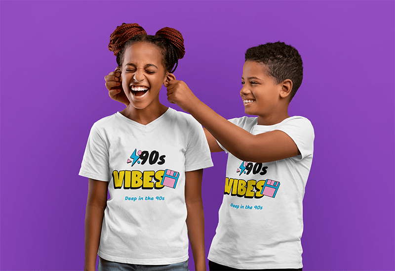 T Shirt Mockup Of Two Siblings Happily Playing In A Studio